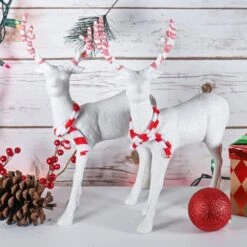 Red And White Peppermint Christmas Reindeer - Holiday White Deer Figurine Statues With Antlers Centerpiece (Pack Of 2) -Northlight Shop christmas centerpieces or 226 1f 1000