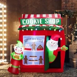 6.3 Ft. H X 5.3 Ft. Self Inflatable Santa Claus Cookie Shop Christmas Decoration With Colorful Lights -Northlight Shop christmas inflatables gym10152 76 1000