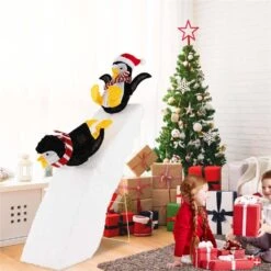4 Ft. Pre-Lit Christmas Penguin Ice Skating Decoration With Snowy Slide And LED Lights -Northlight Shop costway christmas yard decorations cm24281us 1f 1000