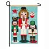 Evergreen 18 In. X 12.5 In. Nutcracker Trio Garden Linen Flag -Northlight Shop evergreen christmas garage door decorations 14l8610bl 64 1000