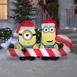4 Ft. Airblown-Minions Carrying Candy Cane-MD Scene-Universal -Northlight Shop gemmy christmas inflatables g 114781 31 1000