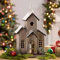 16 In. H B/O Lighted Wood House With Pine And Berry Accent -Northlight Shop gerson international christmas villages 2429600ec 31 1000