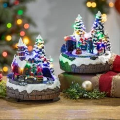 7.5 In. H B/O Lighted Christmas Musical Village With Moving Train With Timer (6/18hrs.) Uses 3 AA Batteries (Set Of 2) 5 7.5 In. H B/O Lighted Christmas Musical Village With Moving Train With Timer (6/18hrs.) Uses 3 AA Batteries (Set Of 2) -Northlight Shop gerson international christmas villages 2599590ec 31 1000