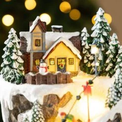 15.50 In. Lighted Skiing Moutain Resin Christmas Village With Movement And Music -Northlight Shop glitzhome christmas villages 2040200001 44 1000